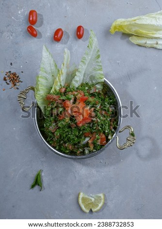 Parsley salad with onions and tomatoes (tabouleh)