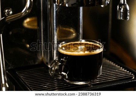 Coffee special shot just finished and ready for serving with hot espresso menu. Concept photos of coffee maker inside the bar cafe.