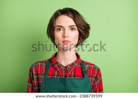 Photo of optimistic nice short brown hair lady wear red shirt isolated on pastel green color background