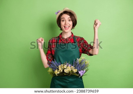 Photo of hooray nice short brown hair lady wear cap shirt isolated on pastel green color background