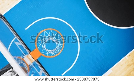 Top Down Shot Of Basketball Hoop At Sports Court In International Arena. Empty Playing Field Where Professional Matches And Games Are Held Awaiting For Begining Of Tournament, Players to Come Out.