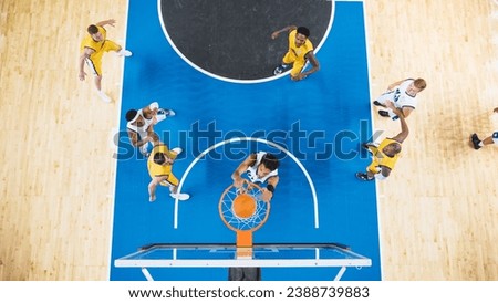 Basketball Tournament Final: Middle Of International Match With Basketballers Continuing Playing After Team Scored A Goal. Shot From Basketball Hoop Point Of View. Fans Are Watching The Game