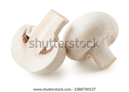 One whole and halved fresh white champignon mushroom isolated on white background Royalty-Free Stock Photo #2388740137