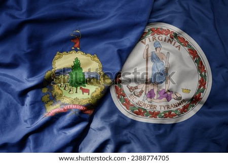big waving colorful national flag of virginia state and flag of vermont state . macro