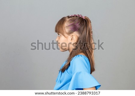 Adorable little girl with braided hair
