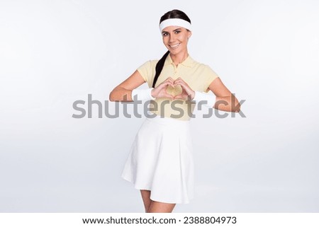 Photo of charming pretty young woman tennis player make hands heart isolated on grey color background