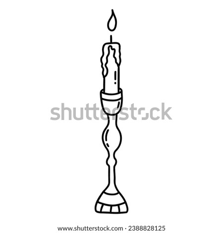 Burning candle in antique candlestick. Black and white vector isolated illustration hand drawn doodle. Winter holiday season. Lighting element icon clip art