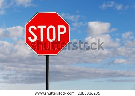 Stop sign. Traffic sign. STOP sign on pole near the road