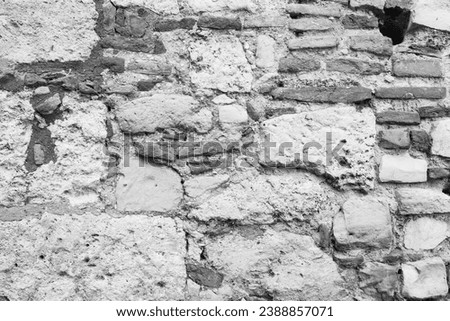 Stone wall from big stones for background design. A backing with natural stones for branding, calendar, postcard, screensaver, wallpaper, poster, banner, cover, website. Toned high quality photography