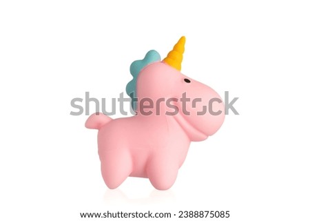 Pink unicorn toy on a whit background. 
Soft toy unicorn.
Squishy Toys.