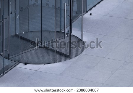 Detail of glass revolving doors Royalty-Free Stock Photo #2388884087