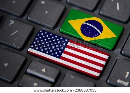 USA and Brazil flags on computer keyboard. Relationship between two countries. Royalty-Free Stock Photo #2388887033