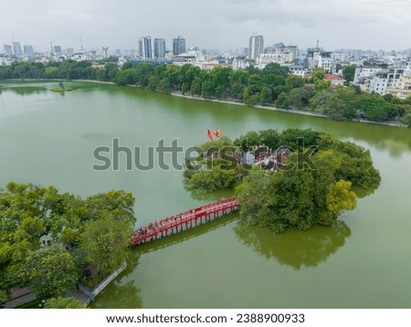 Aerial view of Ngoc Son temple with The Huc bridge on Hoan Kiem lake, Hanoi, Vietnam. Royalty-Free Stock Photo #2388900933