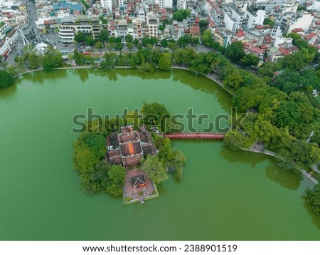 Aerial view of Ngoc Son temple with The Huc bridge on Hoan Kiem lake, Hanoi, Vietnam. Royalty-Free Stock Photo #2388901519