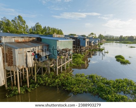 Rural scene with floating houses during flood season in Mekong Delta in Southern Vietnam