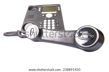 Modern desktop telephone over white background 
