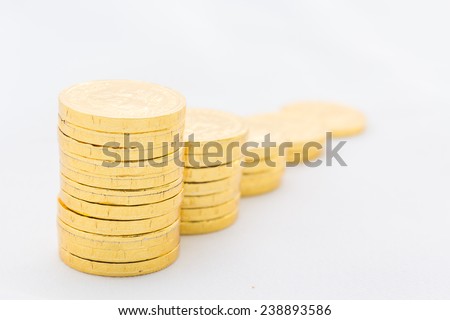 Many coins in column on white background