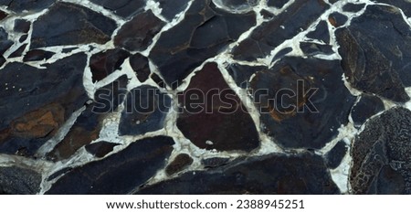 landscape photo of black natural stone with slightly bright light and a natural background
