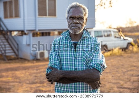 Portrait of an indigenous aboriginal man at sunset.  Royalty-Free Stock Photo #2388971779