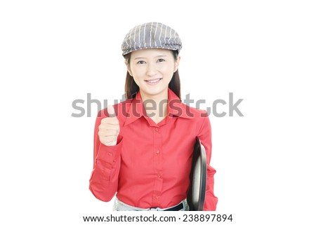 Young waitress showing thumbs up sign