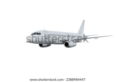 Passenger jet plane flies isolated on white background Royalty-Free Stock Photo #2388984447