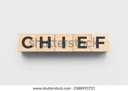 Chief wooden cubes on grey background Royalty-Free Stock Photo #2388993721