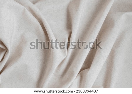 Soft crumpled neutral oat beige linen fabric texture background with folds, aesthetic minimal luxury boho wedding or business brand template, backdrop.