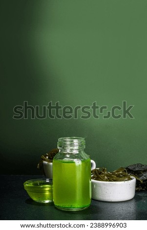 Algae based Oil, Seaweed alternative vegan oil, monounsaturated healthy fat ingredient with Algae Seaweeds Royalty-Free Stock Photo #2388996903