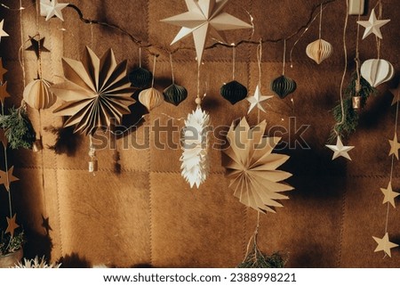 Christmas decor made of beige paper, Christmas origami