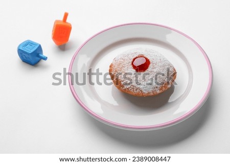 Hanukkah donut and dreidels on white background