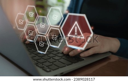 Problem and error warning concept. Working on computer laptop with triangle caution warning sign, warning system for notification error and maintenance. Incident, risk, contingency management.  Royalty-Free Stock Photo #2389028117