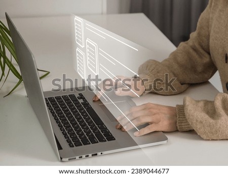 Businesswoman using laptop Enterprise Resource Planning ERP, document management concept with icons on virtual screen, Business woman working with laptop computer with icons on virtual screen.