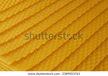 Seamless pattern of natural beeswax sheets on background. Banner. Top view, flat lay.                           