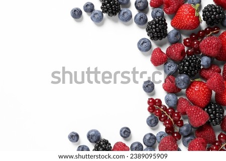 Many different fresh berries on white background, flat lay. Space for text