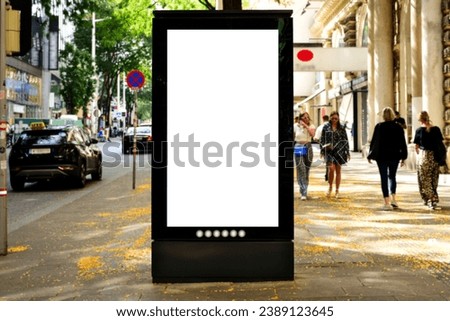 billboard on street corner. blank white poster and advertiser ad space. digital outdoor display lightbox. mockup base. empty display panel. glass design. soft streetscape. shopping street background