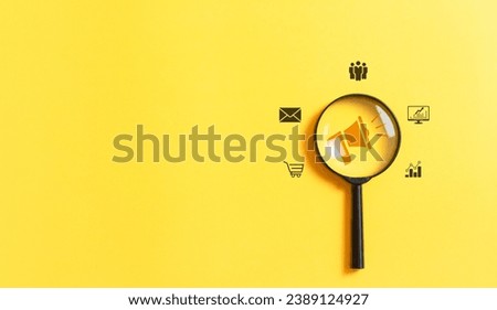 Digital marketing media concept. Magnifying glass focus global advertising with megaphone symbol on yellow background for advertising something and public relations on internet network.