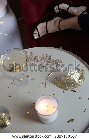 Christmas symbols items on a red background champagne candle gold inscription