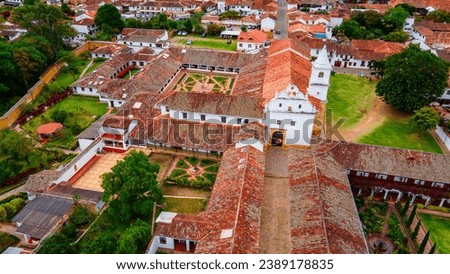 Aerial view of Villa de Leyva, a colonial town in Boyacá, Colombia, showing its white buildings and a church