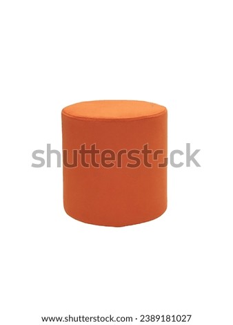 unusual modern orange cylindrical padded stool upholstered with soft fabric in strict style isolated on white background. Creative approach to making furniture in shape of cylinder Royalty-Free Stock Photo #2389181027