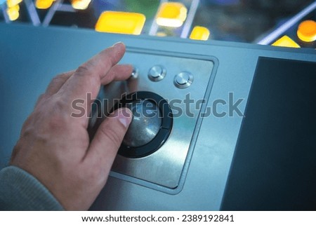 The hand controls the trackball with buttons Royalty-Free Stock Photo #2389192841