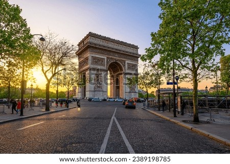 Paris Arc de Triomphe (Triumphal Arch) in Chaps Elysees at sunset, Paris, France. Cityscape of Paris. Architecture and landmarks of Paris Royalty-Free Stock Photo #2389198785