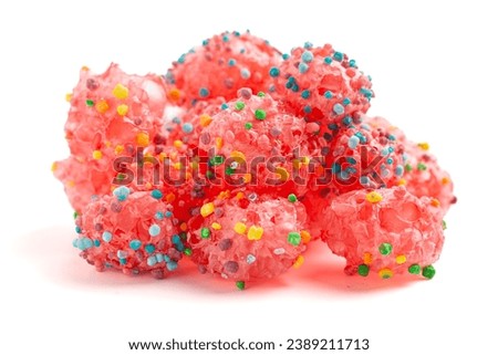 A Freeze Dried Sweet and Tangy Candy with Small Candies on the Outside of a Chewy Center on a White Background Royalty-Free Stock Photo #2389211713