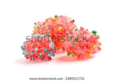 A Freeze Dried Sweet and Tangy Candy with Small Candies on the Outside of a Chewy Center on a White Background Royalty-Free Stock Photo #2389211721