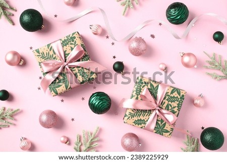 Chic Christmas gift boxes on pink background. Luxury present boxes with ribbon bow, balls, confetti. Perfect for holiday cards, banners, and invitations. Merry Xmas and Happy New Year