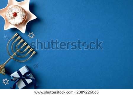 Hanukkah table adorned with menorah, sufganiyot, gift box. Celebrate the holiday spirit with this cultural greeting card design