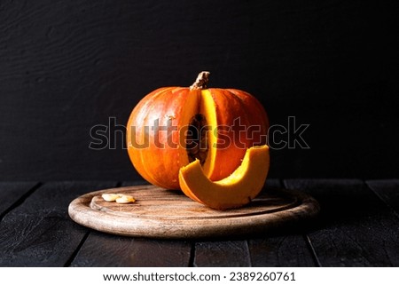Pumpkin on the table on a dark background
