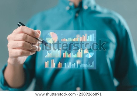 The organization meticulously reviews its financial performance, ensuring accurate calculations of currency exchange rates and numbers. Royalty-Free Stock Photo #2389266891