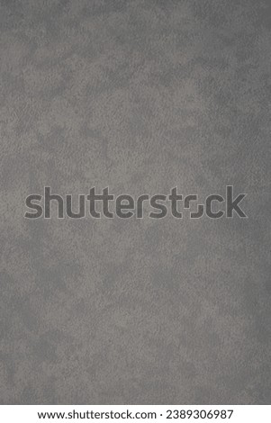 The mottled gray and white fabric surface is suitable for making a background.