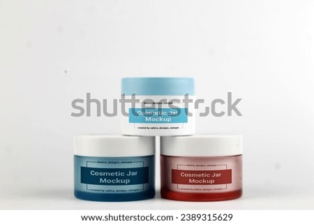 This image showcases two jars of cosmetic cream placed on a white surface. The jars are designed as a cosmetic jar mock-up, which means they are not actual products but rather a representation of what