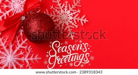 Christmas greeting with snow picture with red ball on pink background